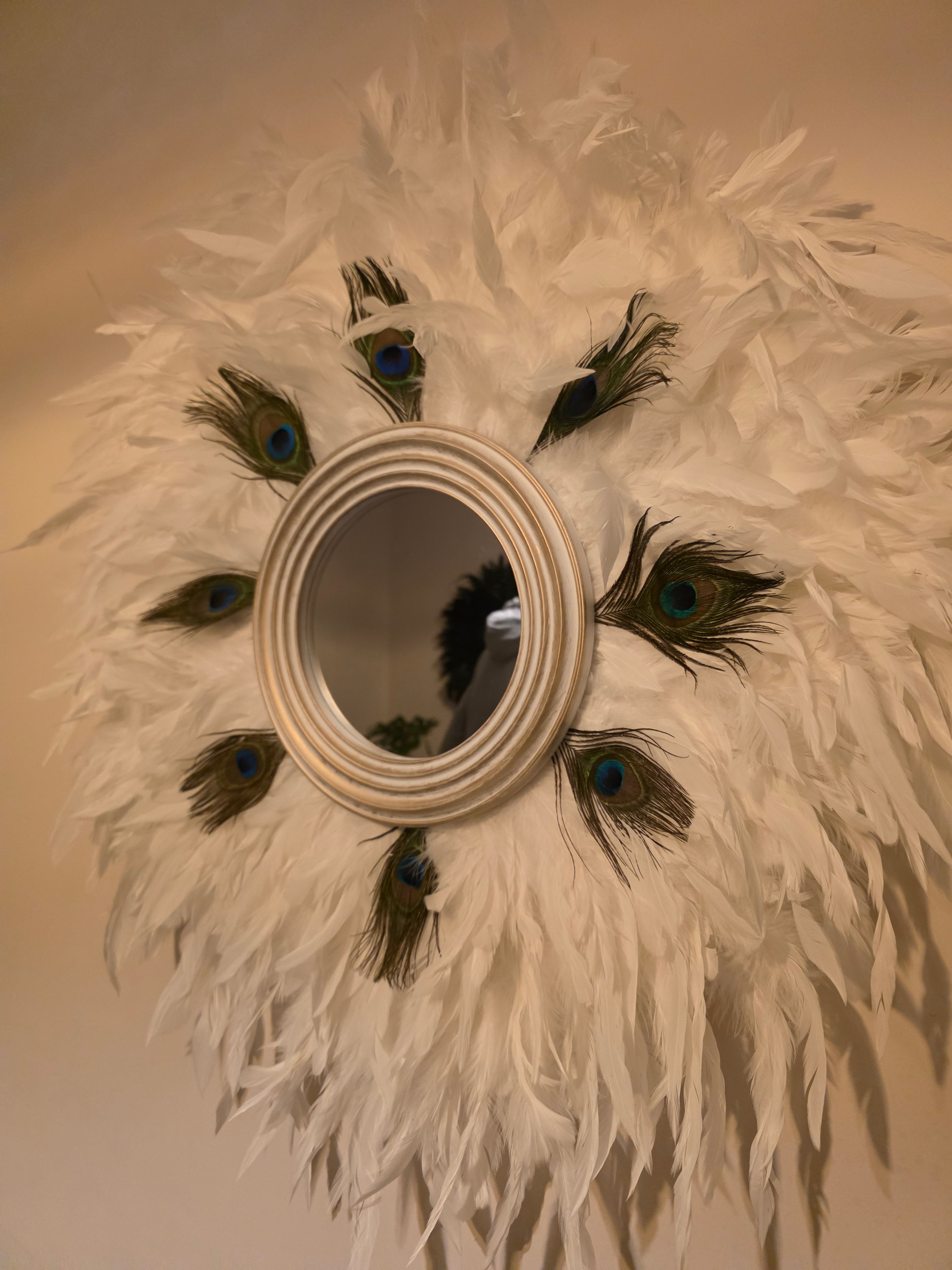 White handmade feathered mirror