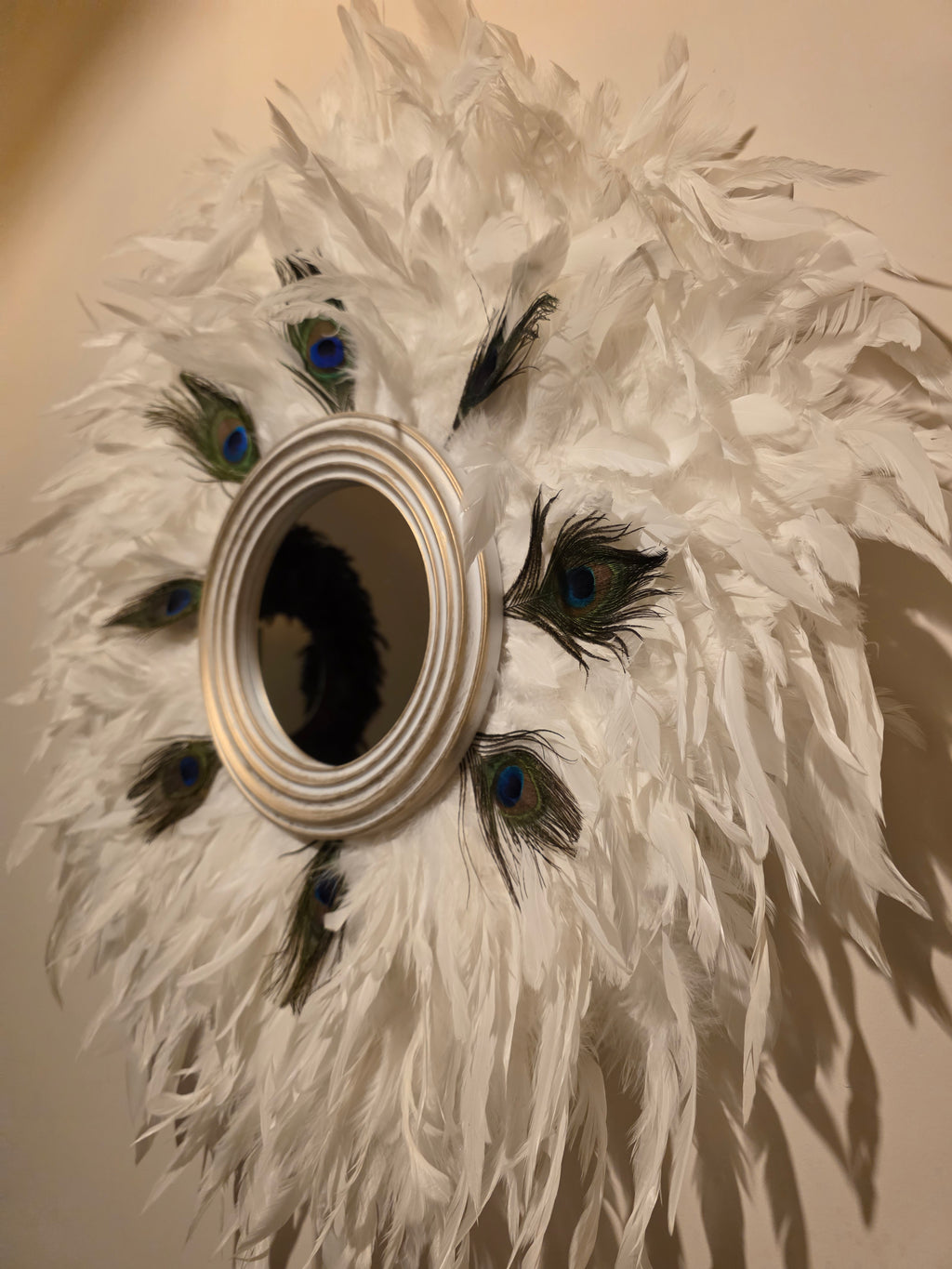 White handmade feathered mirror