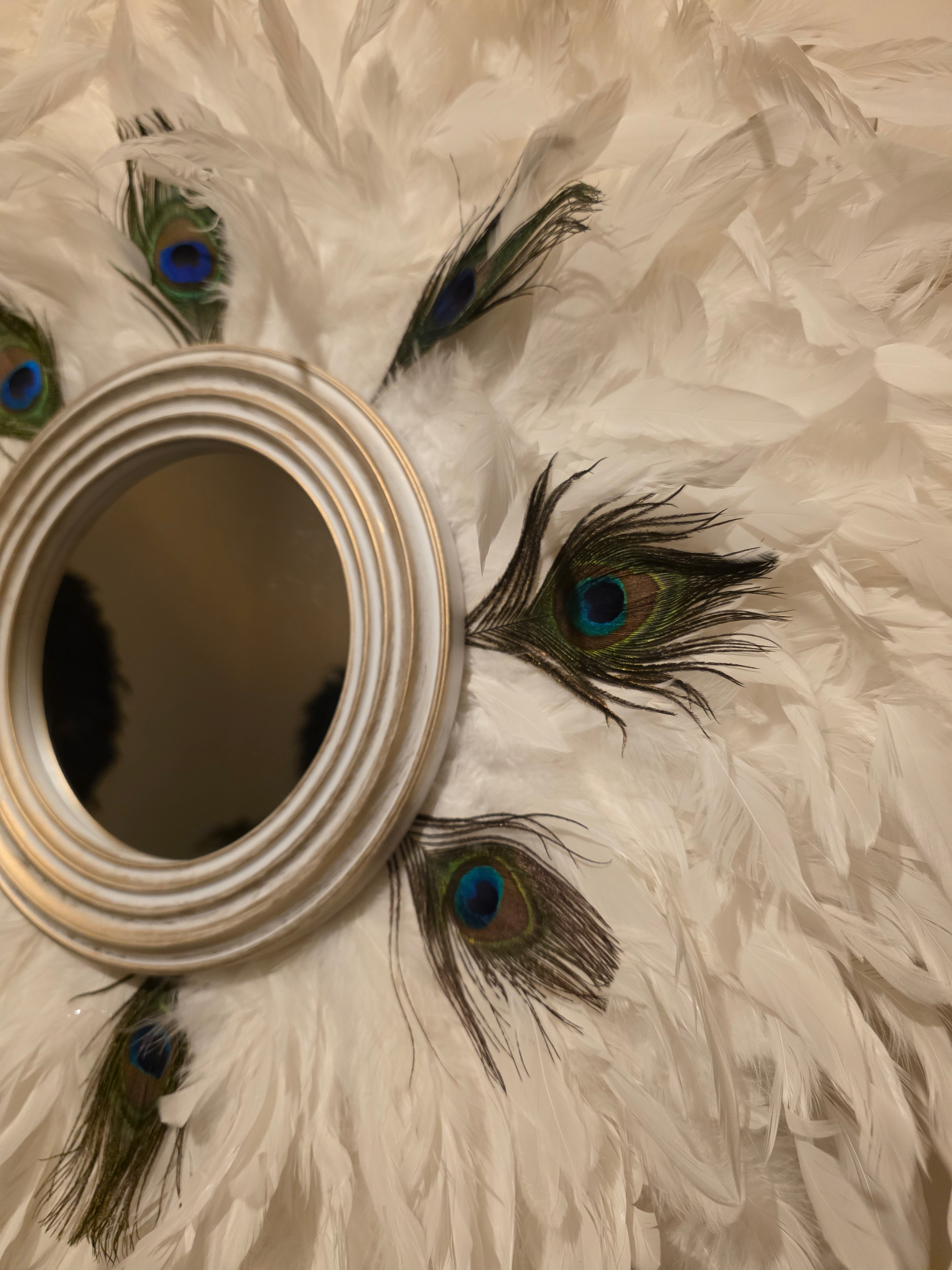 White handmade feathered mirror